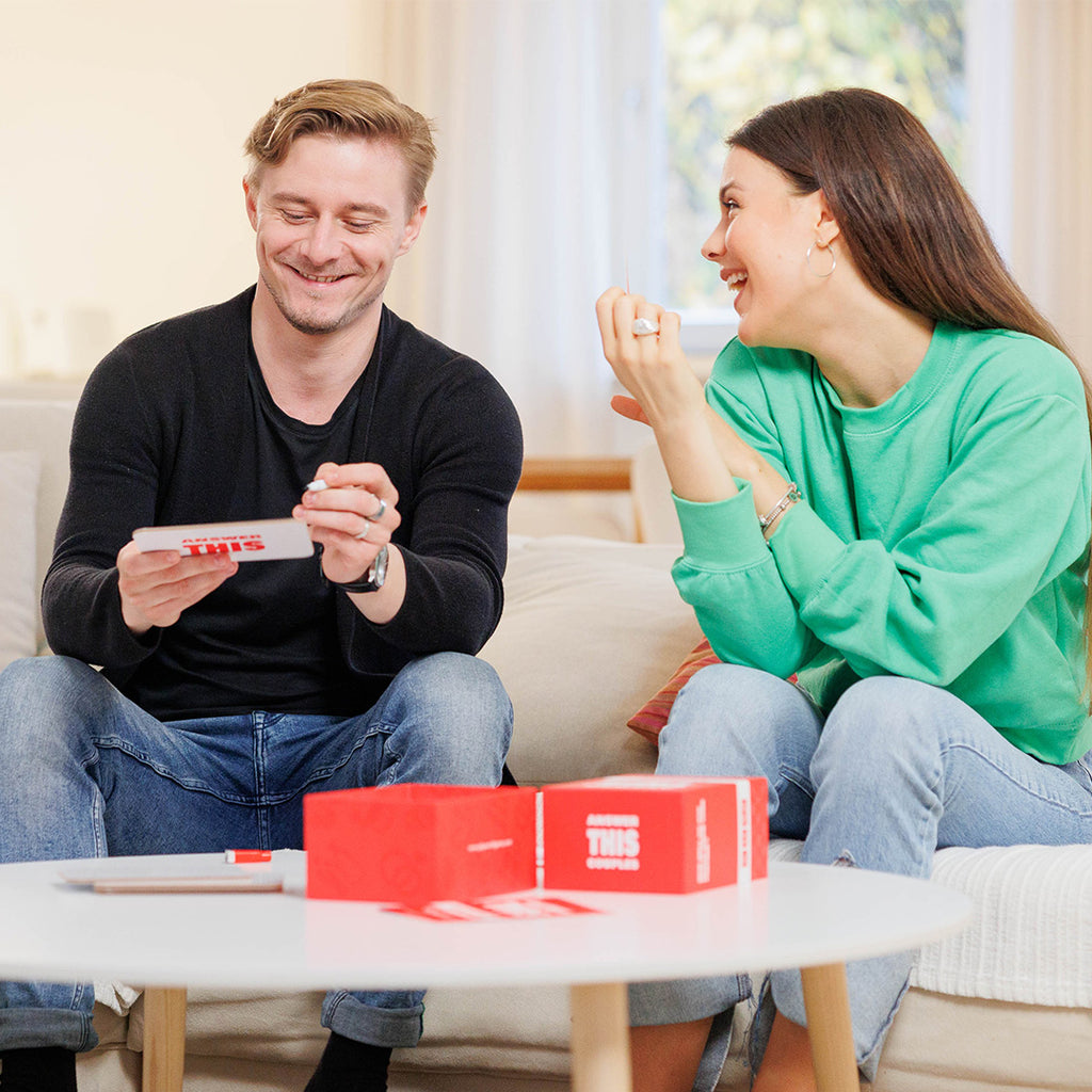 Couple playing games / Valentine's Day Ideas: Add a Twist of Strategy to Your Romantic Night with Board Games