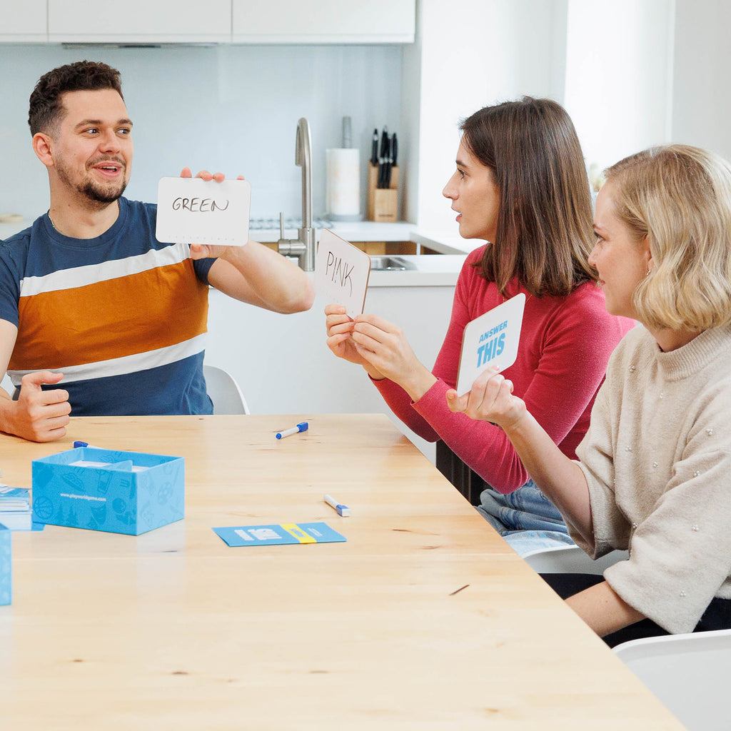 group of friends playing card game as icebreaker to make party or gathering more fun and to get to know eachother