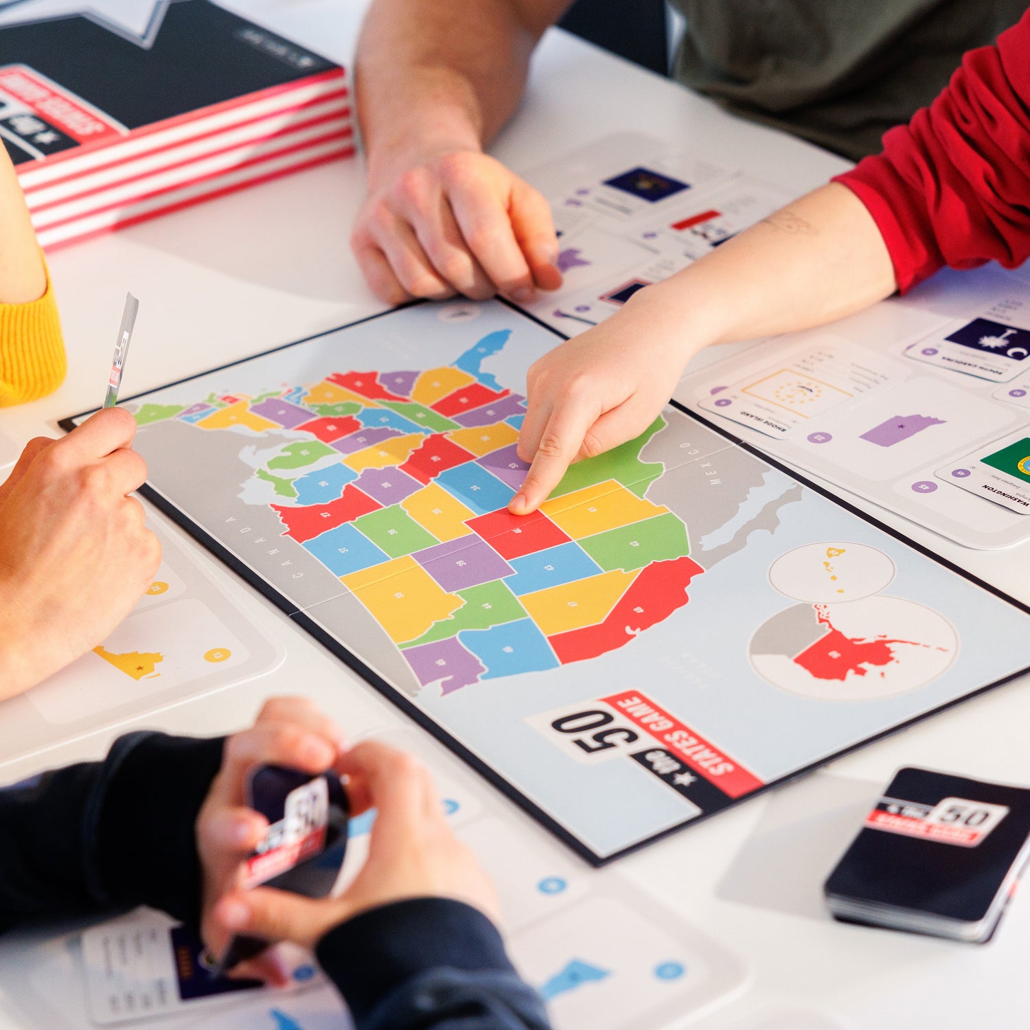 family playing the 50 states game board game a great united states learning table game for young kids families and friends